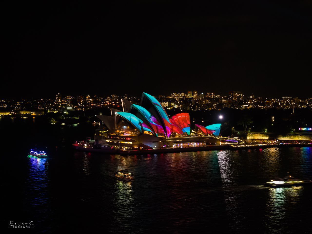 ILLUMINATED CITYSCAPE AGAINST SKY AT NIGHT IN CITY