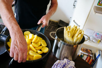 Midsection of man preparing food