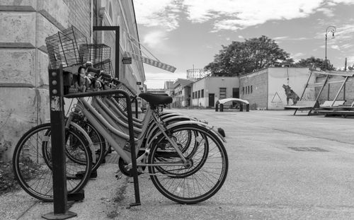 Bicycles on street by buildings