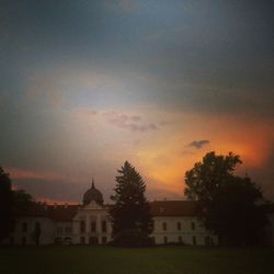 Built structure against sky at sunset