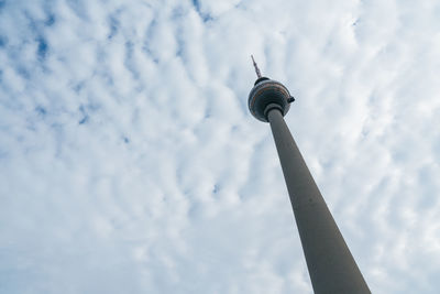 Low angle view of communications tower against sky