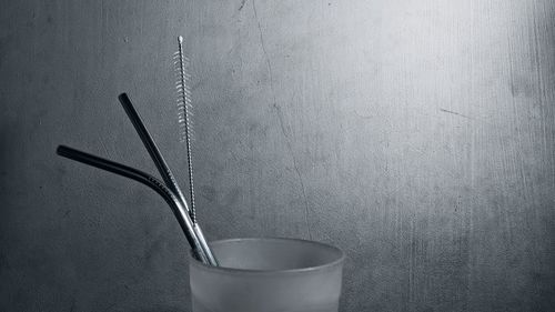 Close-up of drink on table against wall