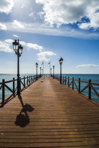 Pier over sea against sky