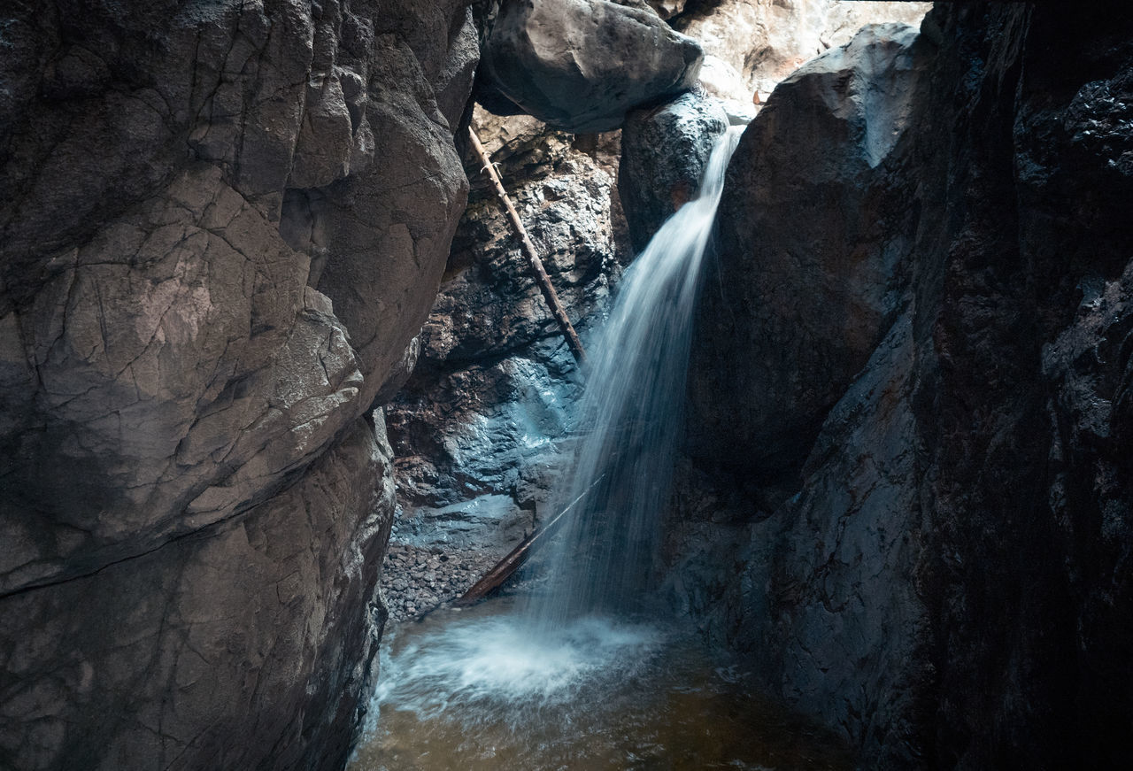 WATER FLOWING THROUGH ROCK