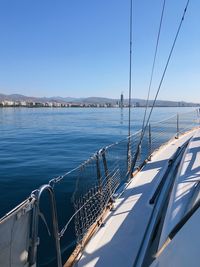 Sailboat on sea against clear sky