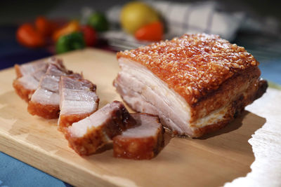 Close-up of roasted pork on cutting board