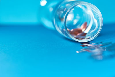 Close-up of blue glass on table