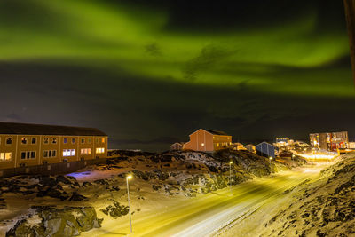 Buildings in city at night