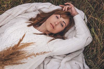 Portrait of woman lying down on land