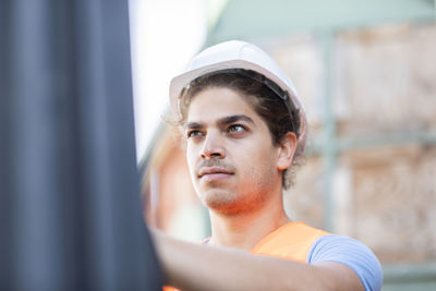 Young store worker with helmet working in a store