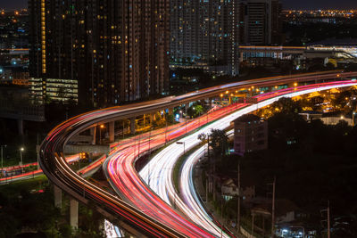 High angle view of light trails on city street at night