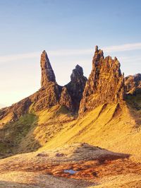 Rock formation on land against sky