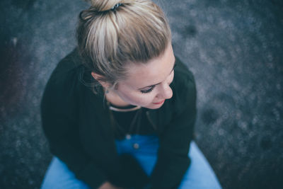 High angle view of woman standing by window