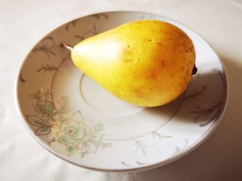 High angle view of fruit in plate on table