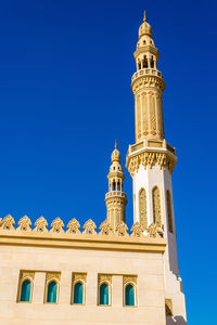 Low angle view of a building against blue sky