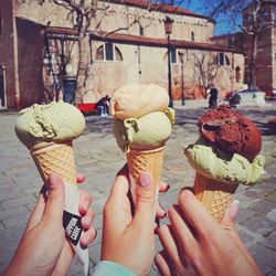 Cropped image of hand holding ice cream cone