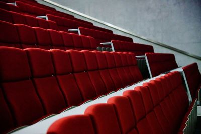 Red empty chairs in movie theater