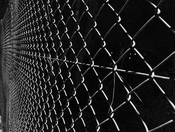 Full frame shot of chainlink fence against sky