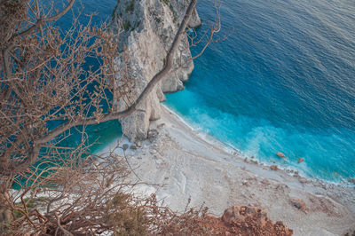Close up of trees with blurred background of misithres cliffs, zakynthos island, greece