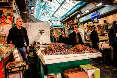 People at market stall