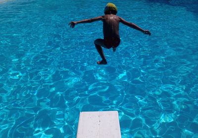 Man swimming in pool