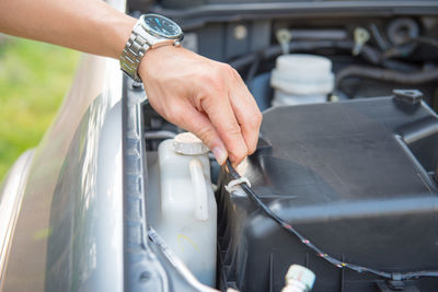 A man checking the auto engine,  uses a wrench to fix the car engine,repair service.