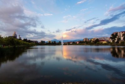 Scenic view of lake against sky at sunset