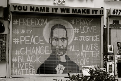 Portrait of man with text on window