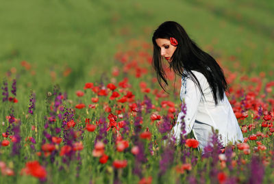 Woman standing on field