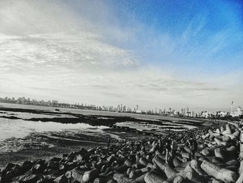 Scenic view of sea against cloudy sky