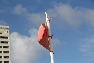 Low angle view of flag against the sky