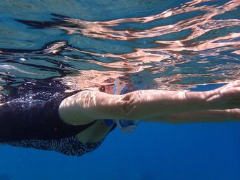 Woman swimming in sea