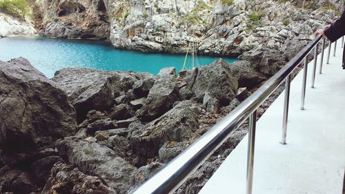 High angle view of rock formations by sea