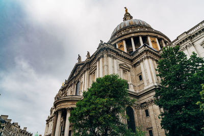 Low angle view of historical building against cloudy sky