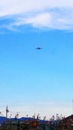 Low angle view of airplane flying in sky