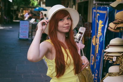 Portrait of young woman wearing hat