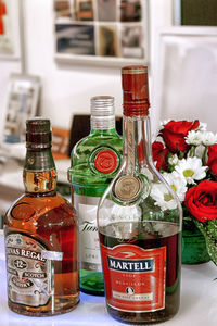 Close-up of flower bottles on table
