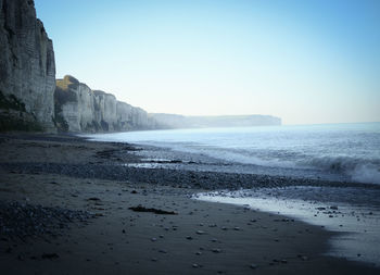 Scenic view of beach against clear sky