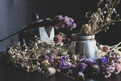 Close-up of purple flower in vase on table