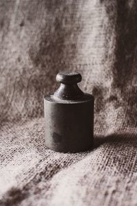 Close-up of old tea light on table