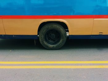 Cropped image of bus parked on road