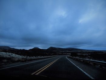 Empty road against sky