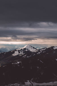 Scenic view of landscape against dramatic sky at night