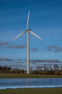 Windmill in landscape outside grenaa, denmark