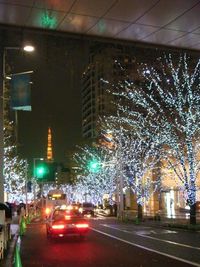 Illuminated city street at night