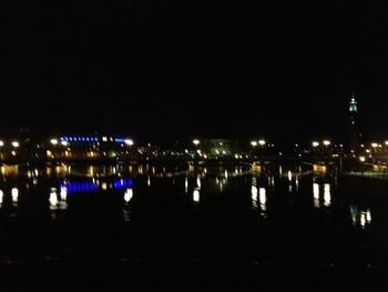 Reflection of illuminated buildings in water