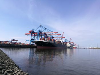 View of cranes at commercial dock