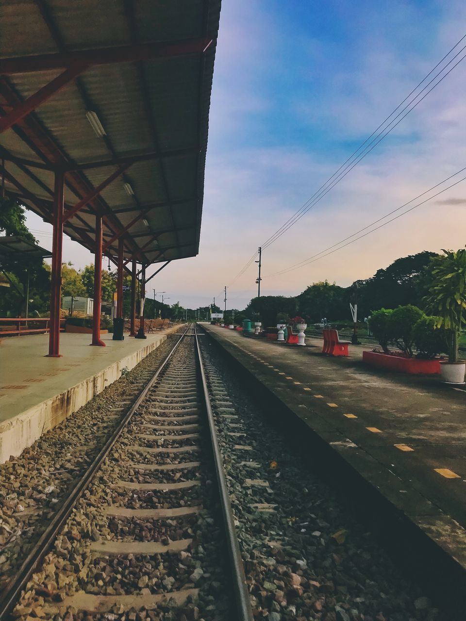 VIEW OF RAILROAD TRACKS AGAINST SKY