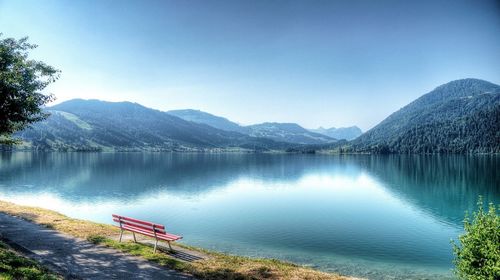 Scenic view of lake with mountains in background