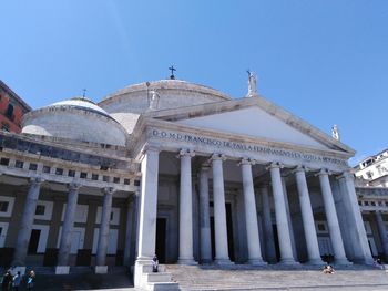 Low angle view of building against blue sky